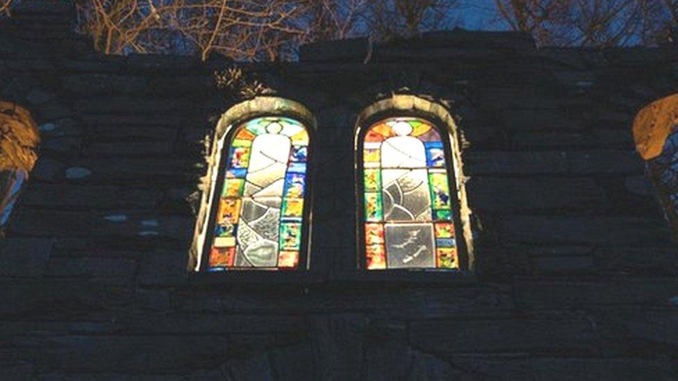 The Chapel lit up at night ft. Christina's stained glass windows