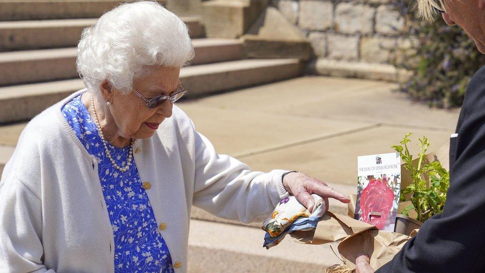 Queen Elizabeth II receives a Duke of Edinburgh rose, given to her by Keith Weed, President of the Royal Horticultural Society,, at Windsor Castle, Berkshire