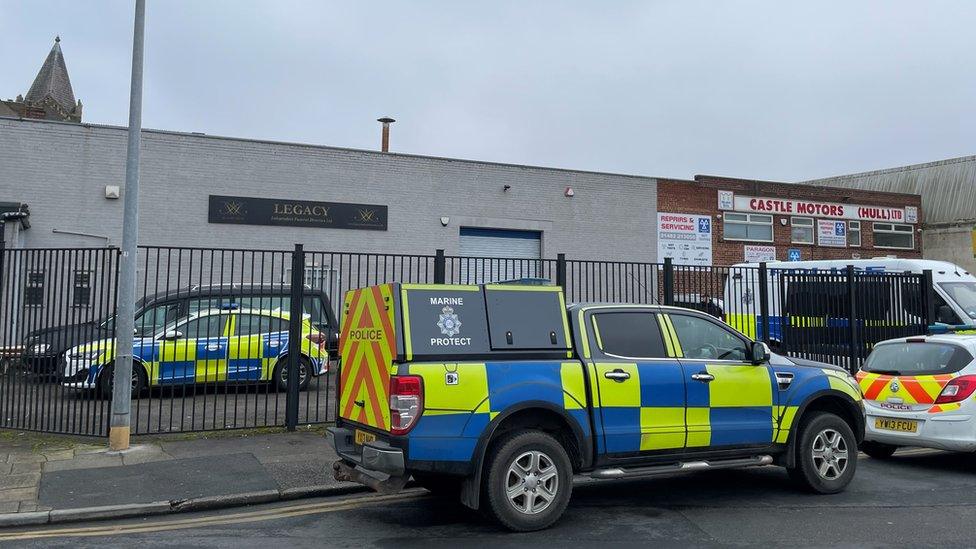 Police vehicles outside funeral directors home