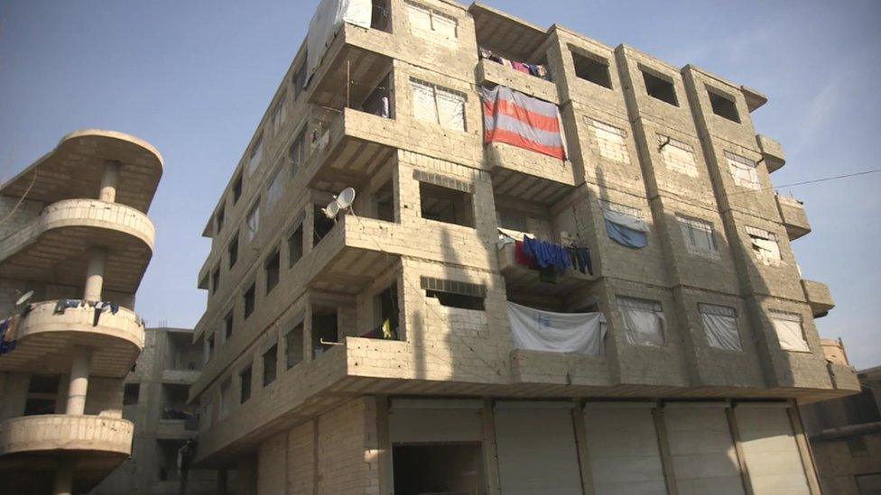 Unfinished building where he lives with his family in Jaramana, on the outskirts of the Syrian capital Damascus