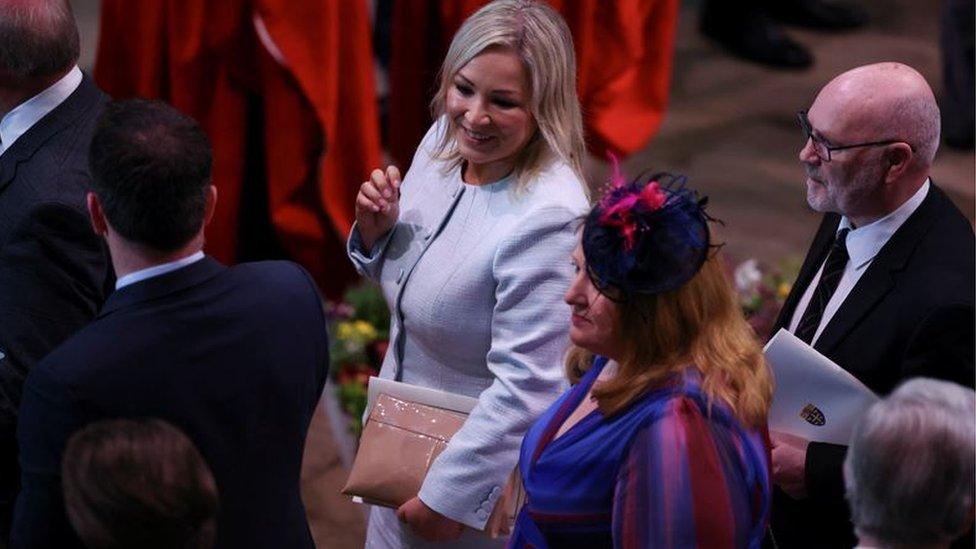 Michelle O'Neill pictured with Alex Maskey and Alliance leader Naomi Long as they departed from Westminster Abbey on Saturday