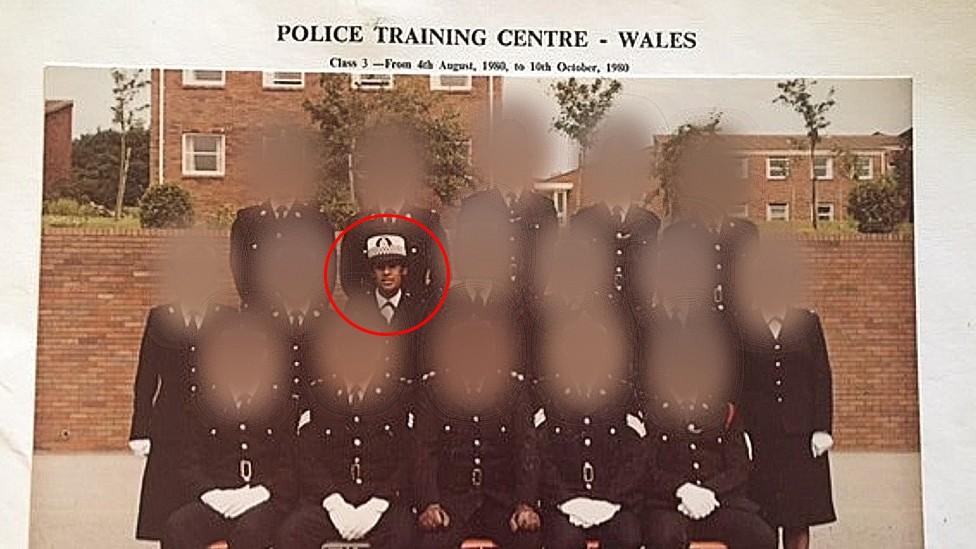 Adora in a police group photo in a training centre in Wales