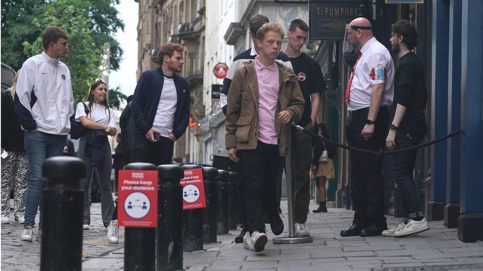 People outside a pub in Newcastle