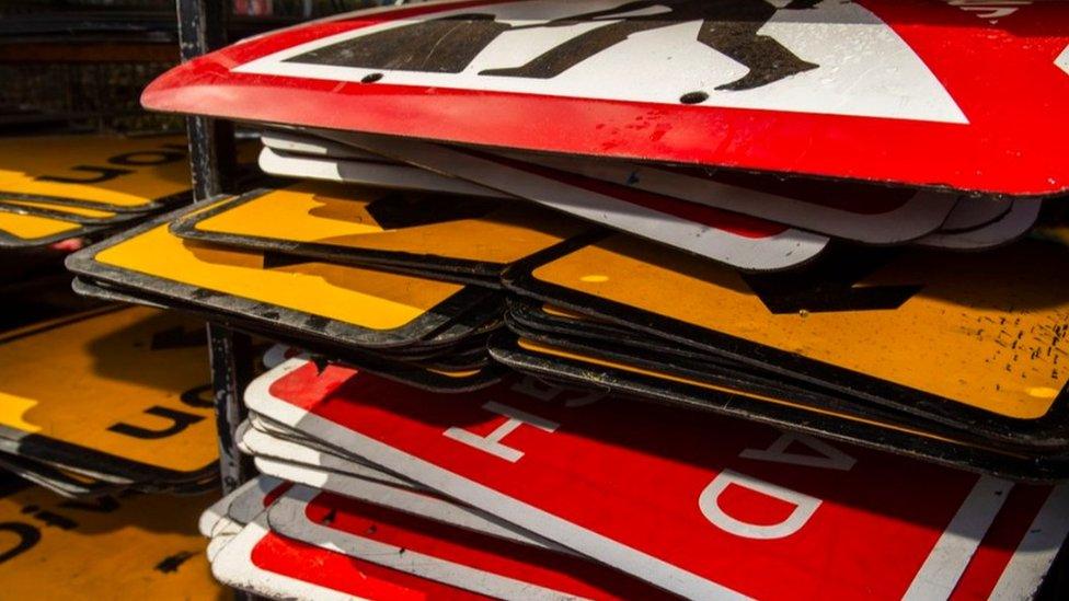 Stack of roadworks signs