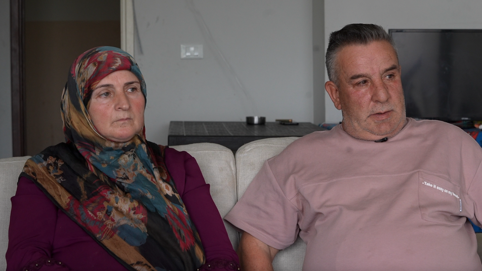 Maryam and Hussein Jawad sitting on a couch