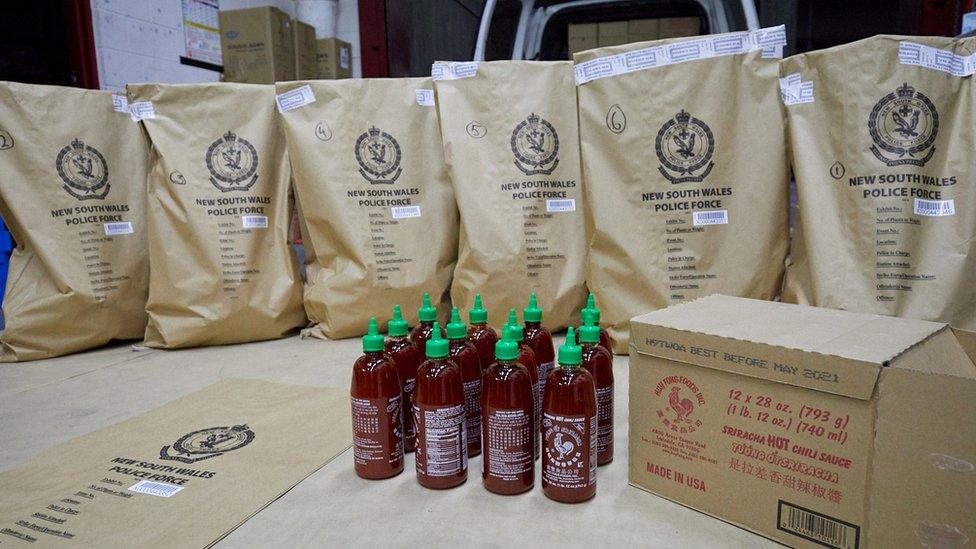 New South Wales police force picture of sriracha chilli sauce bottles carrying hundreds of kilograms of crystal meth