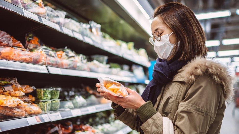 A woman shopping in a supermarket