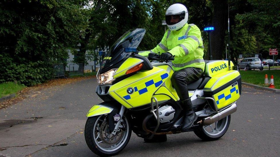 Police officer on motorbike