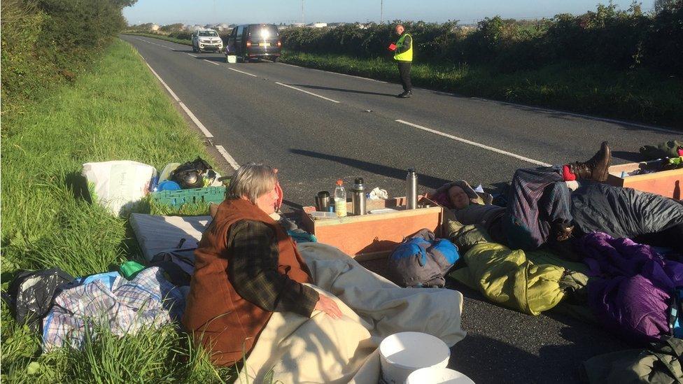 Protesters outside the refinery