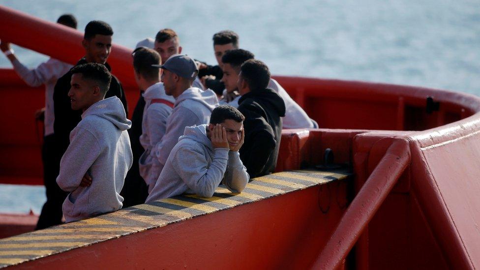 Migrants on a rescue boat