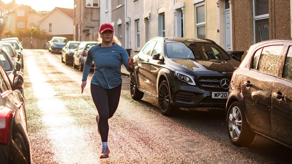 Maria Mcmenemy running down a street.