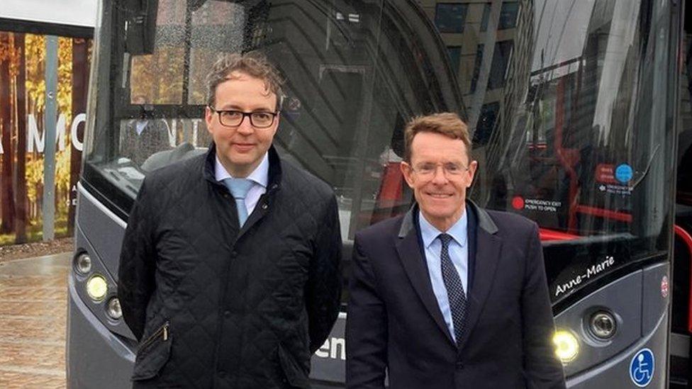 David Bradford and Andy Street in front of a bus