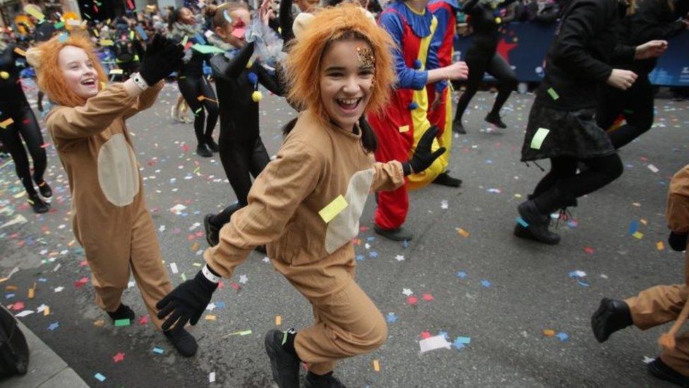 People take part in the London New Year"s Day Parade.