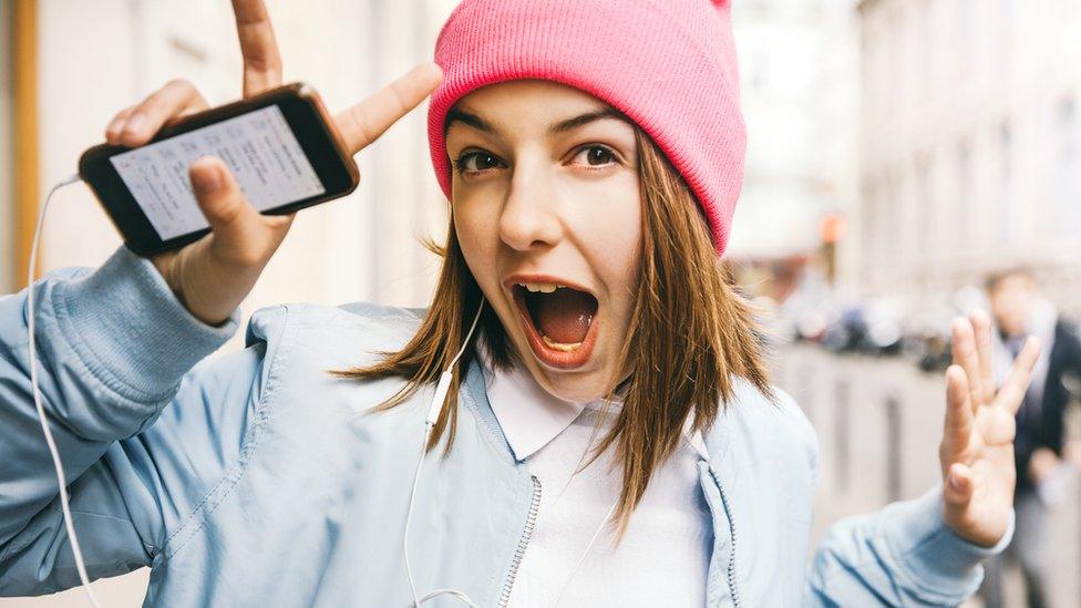 girl-having-fun-with-phone