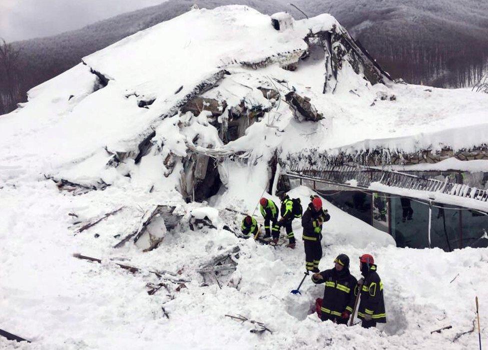 Rescuers at the ruins of the Rigopiano Hotel, 19 January