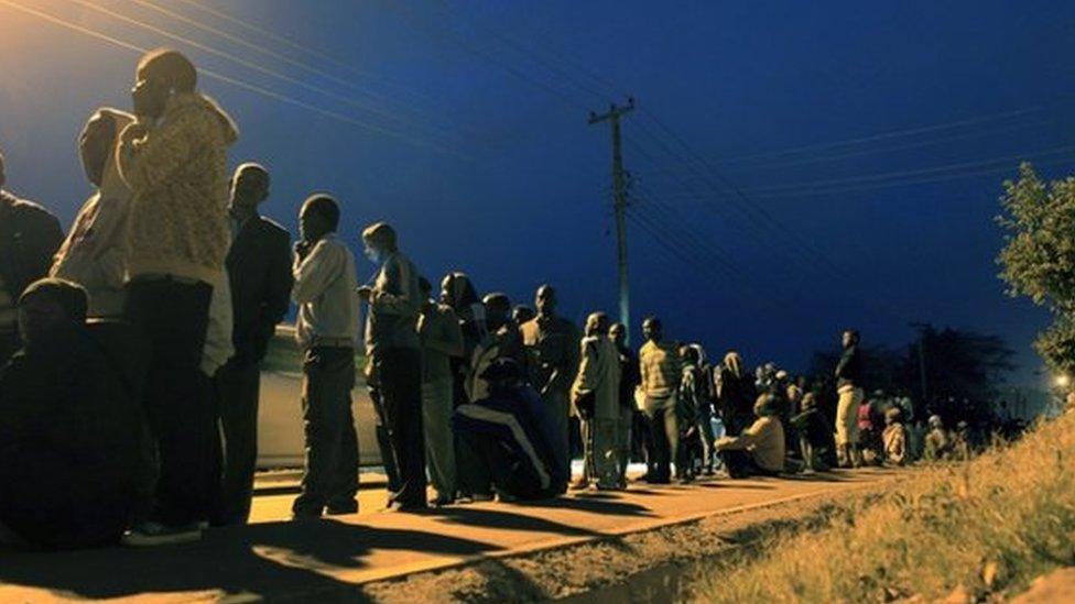 Kenyans wait to cast their vote at a polling station in Kibera in the capital Nairobi 4 March 2013