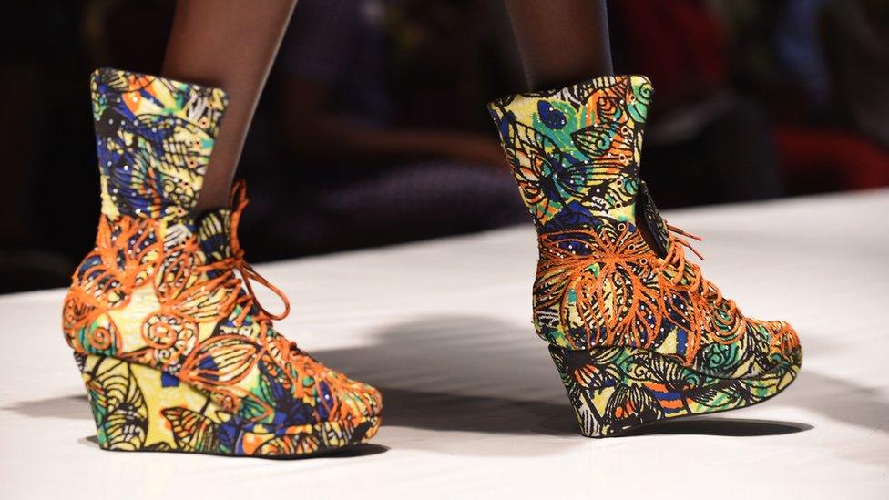 A model presents a design by a top Nigerian designer"s collection featuring Daviva fabrics during Africa Fashion Week in Lagos on July 2, 2016. The three-day event features catwalk and fashion shows from over 50 designers across the continen