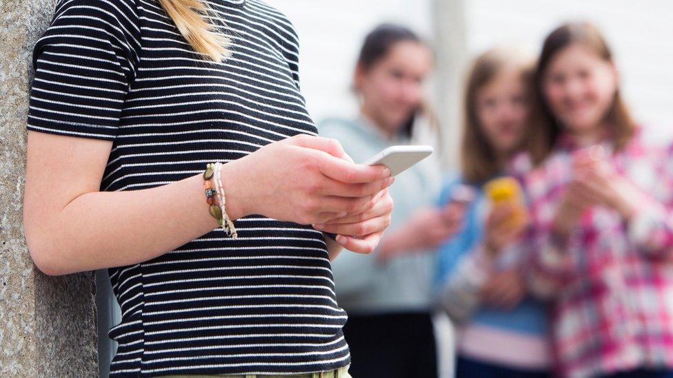 Girl looking at her phone