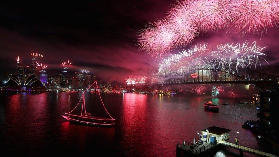 Fireworks light up the sky above the Sydney Harbour Bridge at midnight during New Years Eve celebrations on Sydney Harbour