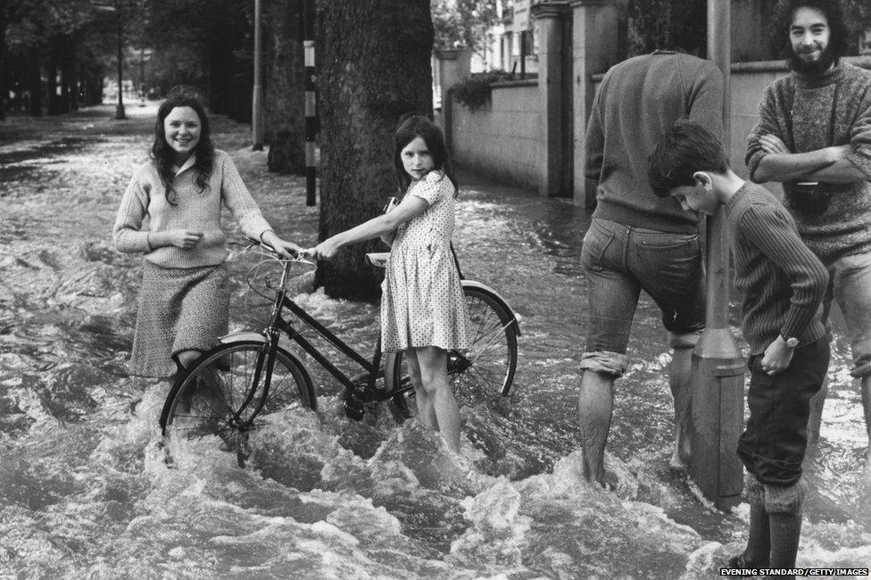 Flooding at the junction of Holland Park Gardens and Bayswater Road, London, after a water main burst