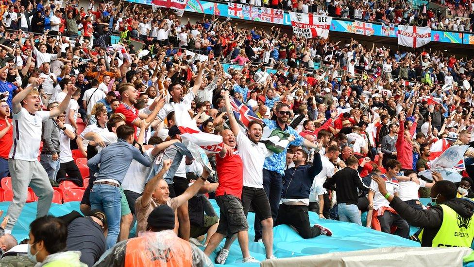 England fans celebrating the win over Germany at Wembley Stadium