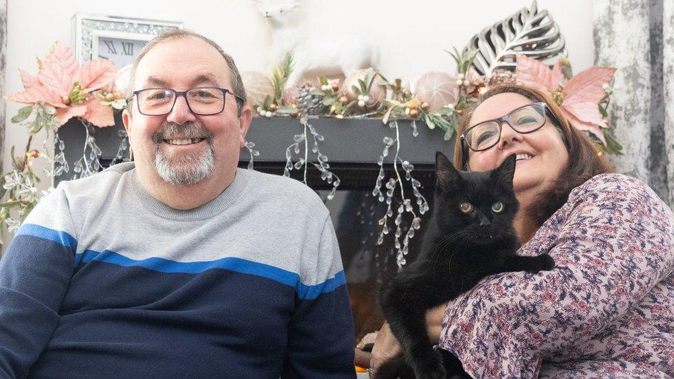 Tony and Deb Pearce with their "lucky" pet cat Billy