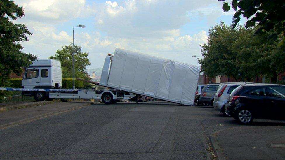 John Boreland's car was removed from the murder scene by police at about 15:45 BST on Monday