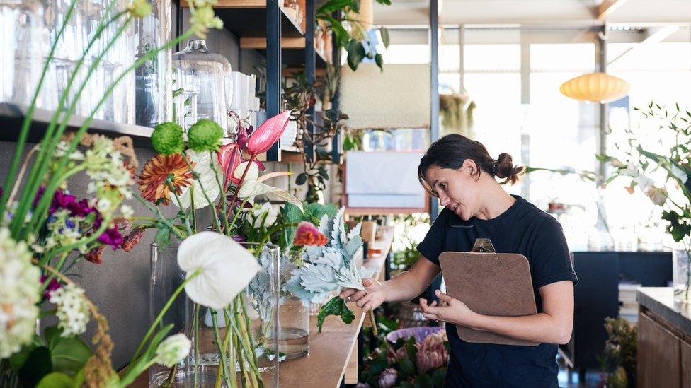 A woman working in a flourist