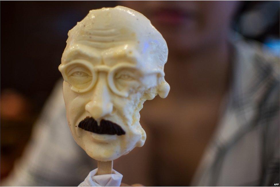 A woman sells an ice cream in the shape of executed Japanese war criminal Hideki Tojo at an ice cream store in Shanghai on 2 September 2015