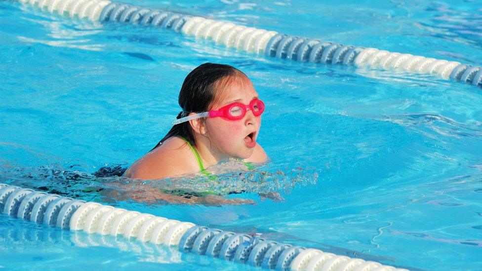 A young girl swimming