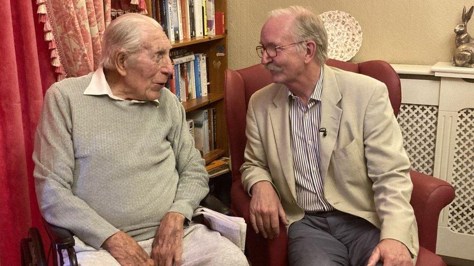 Bob Angles sitting next to Sir George White