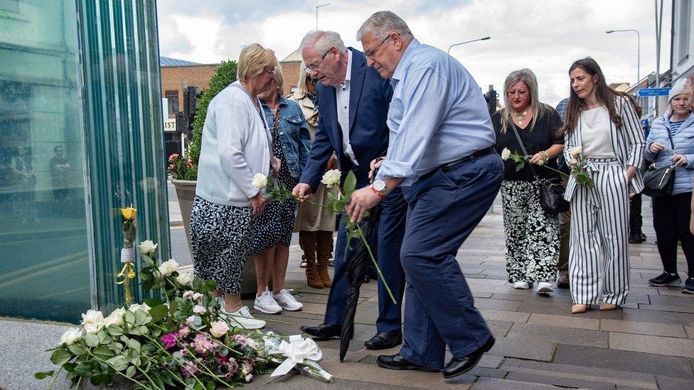 Some bereaved families laid flowers there at 15:10 BST, the time that the dissident republican car bomb exploded.