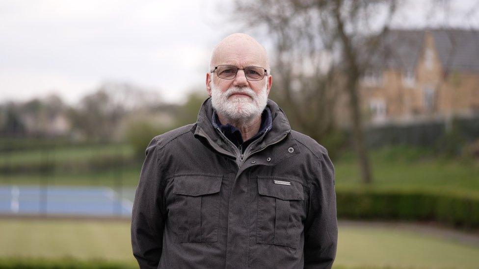 Peter Gray standing on playing fields in Dronfield