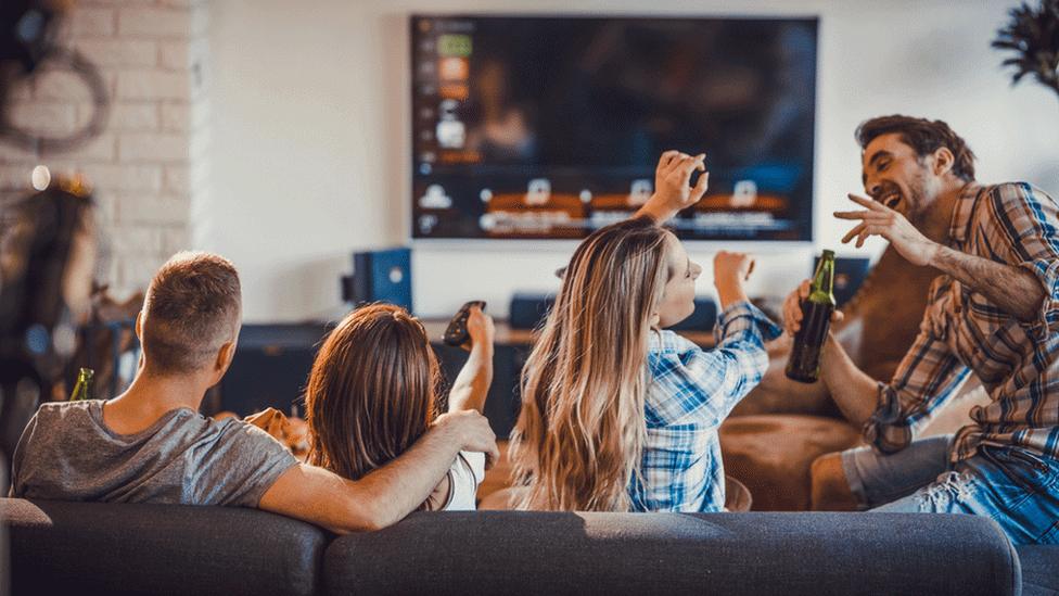 Gang of friends watching TV