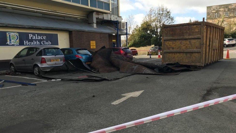 A section of felt roofing came off a hotel roof