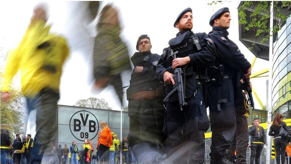 Police officers outside the stadium before the match