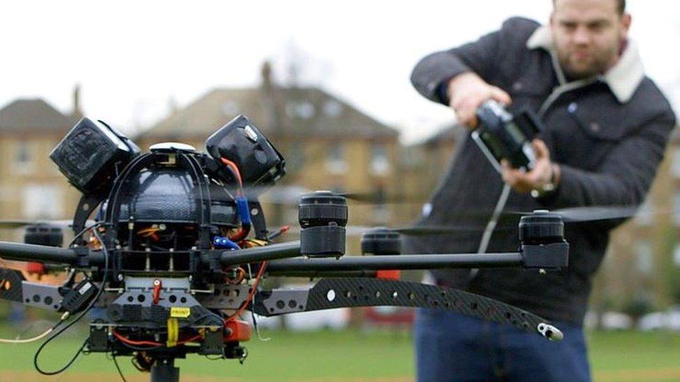 BBC reporter James Waterhouse with a drone