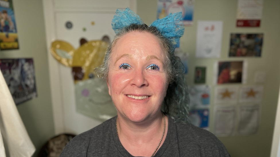 A woman pictured in a kid's bedroom