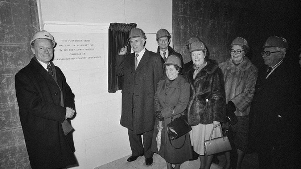 Sir Maurice Laing, Sir Christopher Higgins, Chairman of Peterborough Development Corporation, and other guests posed beside the foundation stone for the Queensgate Shopping Centre during the unveiling ceremony in 1978