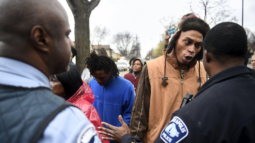 A protester yelling at police