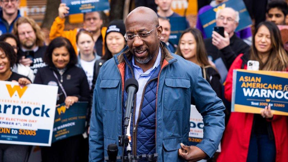 Warnock speaking at a campaign event