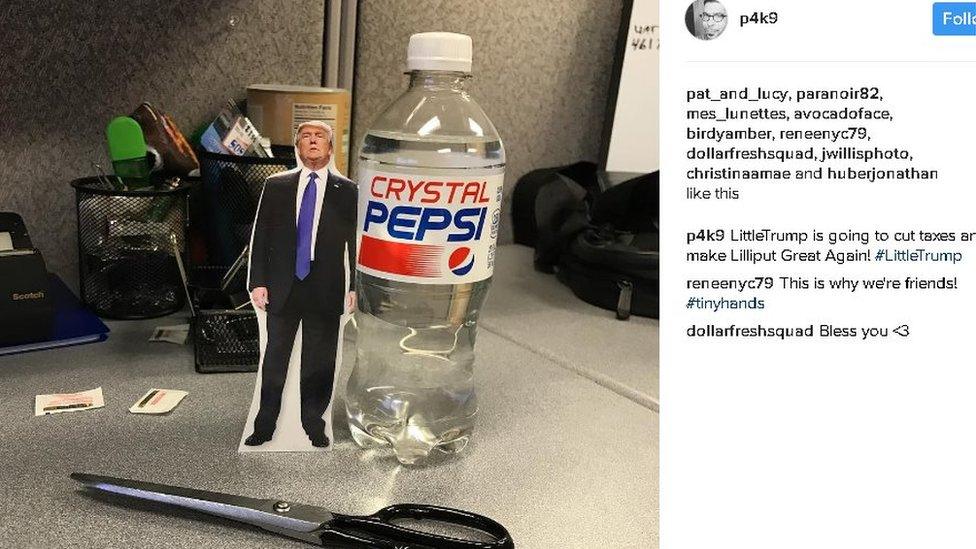 paper cutout of Trump, smaller than the Pepsi bottle it's next to for size comparison; caption reads "Little Trump is going to cut taxes and make Lilliput Great Again!"