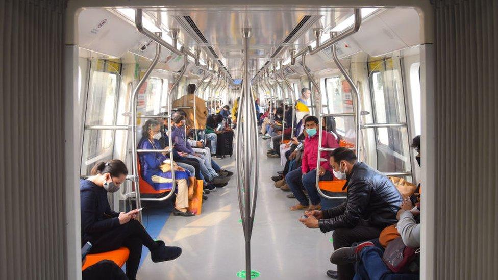 NEW DELHI, INDIA NOVEMBER 25: Commuters travel in a special driverless train on the Delhi Metro Pink Line after the virtual flagging off ceremony, on November 25, 2021 in New Delhi, India. The Pink Line became the second Delhi Metro line to have driverless operations after the Magenta Line.