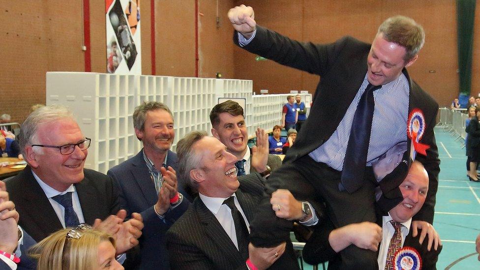 Paul Frew being held aloft after his re-election to the Northern Ireland Assembly in 2017