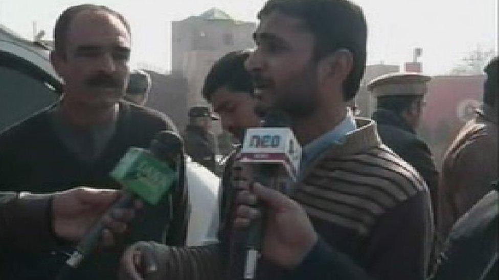 Man speaking into microphone