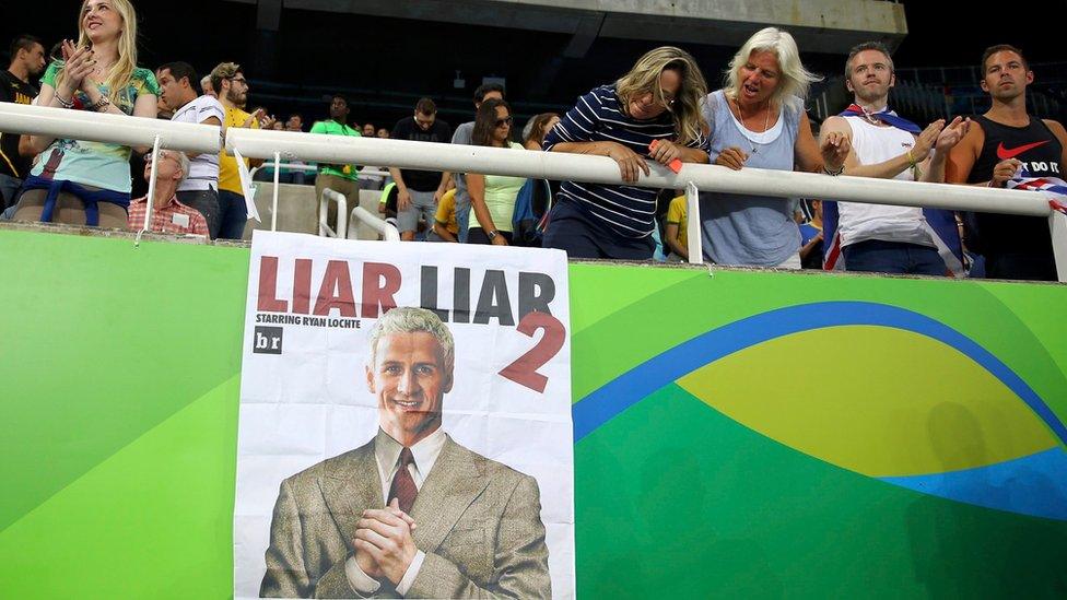 Poster calling Lochte a liar in Rio stadium