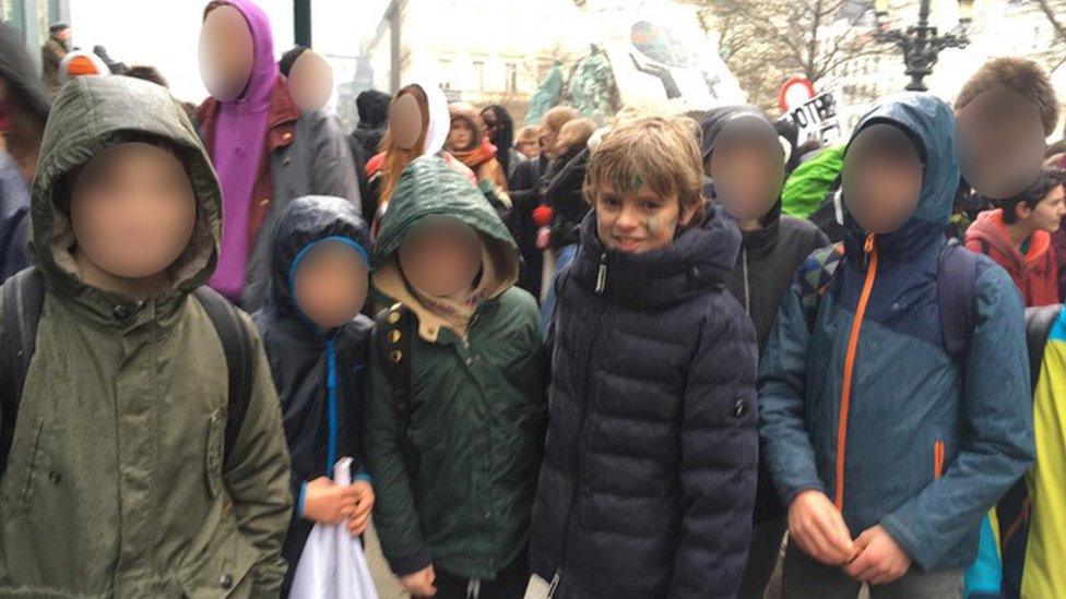 Isidore Vlassenroot, 12, at Thursday's march with friends