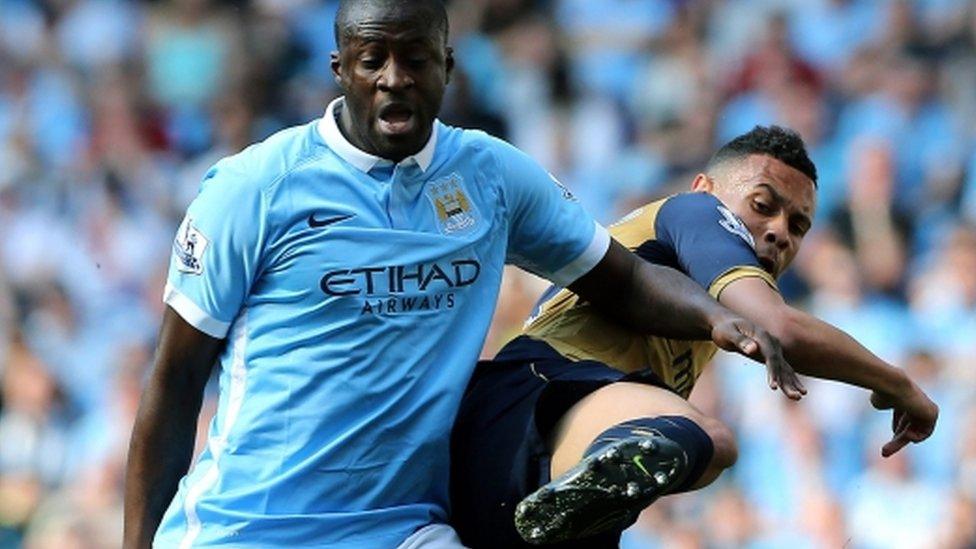 Yaya Toure in action against Kieran Gibbs