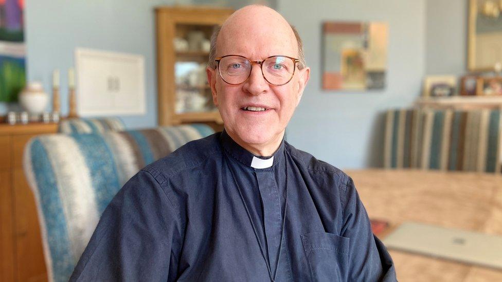 Martin Seeley, the Bishop of St Edmundsbury and Ipswich, sitting in his home