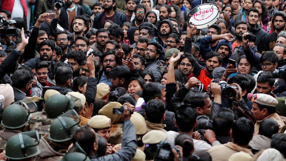 Demonstrators attend a protest against the attacks on students of Jawaharlal Nehru University (JNU) on Sunday, on the university campus in New Delhi